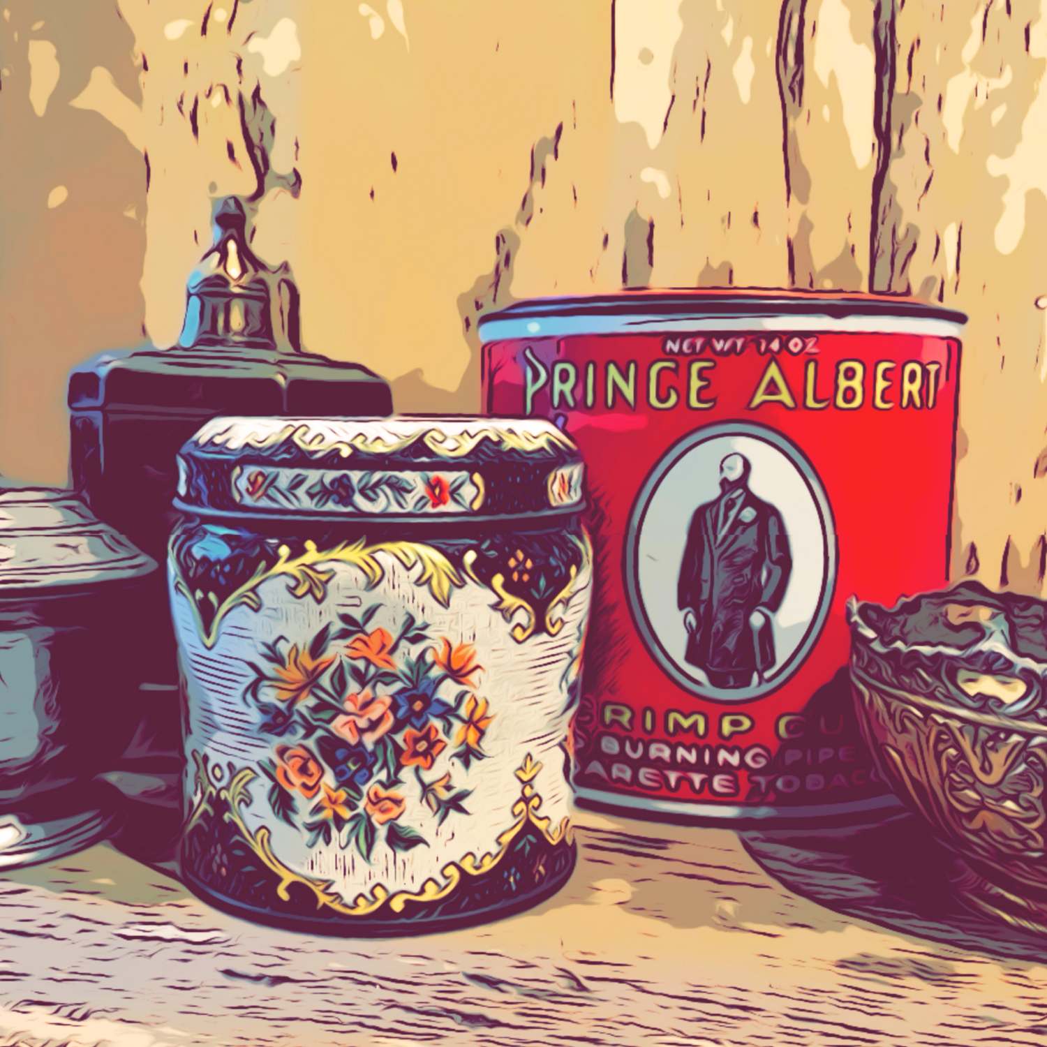 Old metal Tins displayed on table.